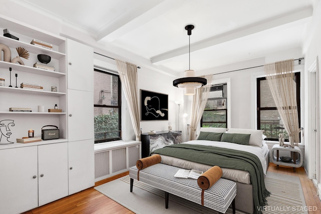 760 W End Ave Unit 1B, New York City, NY 10025 - bedroom with light wood-style flooring, radiator, and beamed ceiling