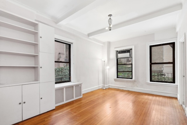 760 W End Ave Unit 1B, New York City, NY 10025 - unfurnished living room featuring radiator, light wood-type flooring, beam ceiling, and baseboards