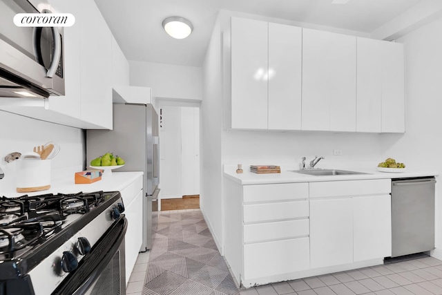 360 E 72nd St Unit B1008, New York City, NY 10021 - kitchen with appliances with stainless steel finishes, modern cabinets, light countertops, and white cabinetry