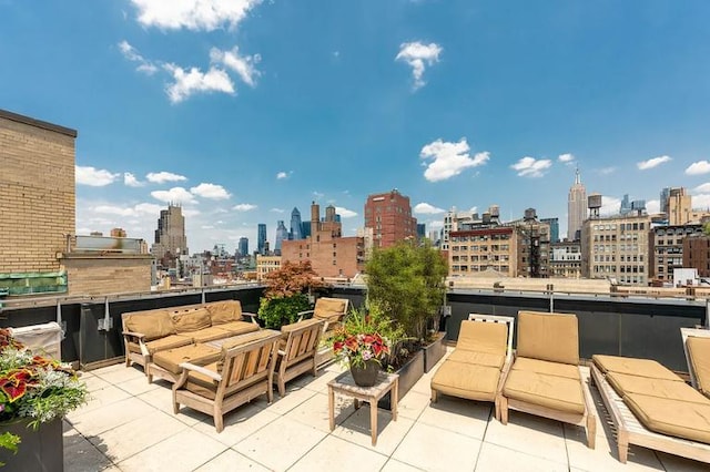 view of patio / terrace with an outdoor hangout area and a view of city