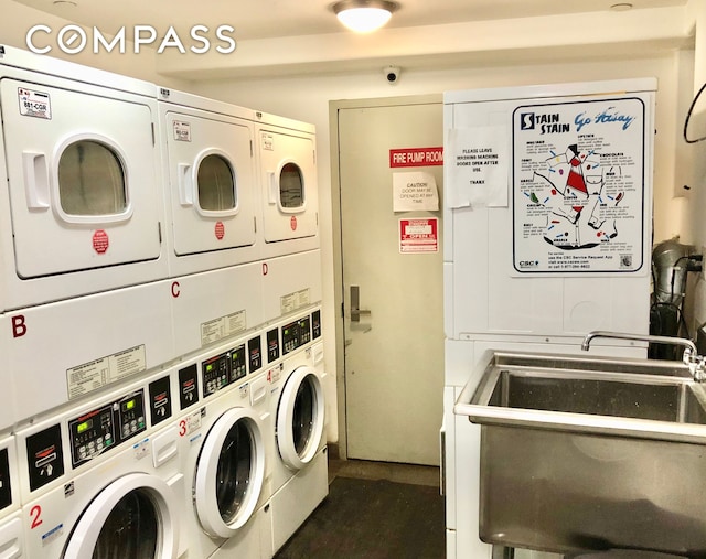 148 E 24th St Unit 4C, New York City, NY 10010 - community laundry room with washing machine and clothes dryer, stacked washer and dryer, and a sink