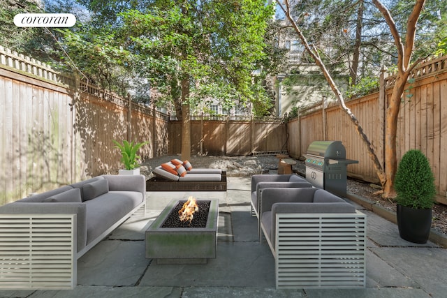 243 E 61st St, New York City, NY 10065 - view of patio with an outdoor living space with a fire pit, a fenced backyard, and area for grilling