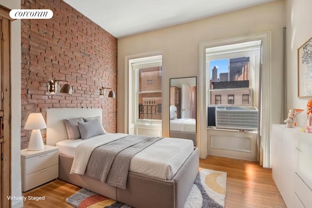 243 E 61st St, New York City, NY 10065 - bedroom featuring light wood-type flooring and cooling unit