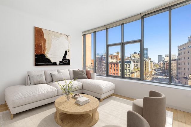 210 Lafayette St Unit 5B, New York City, NY 10012 - living room with a view of city and wood finished floors
