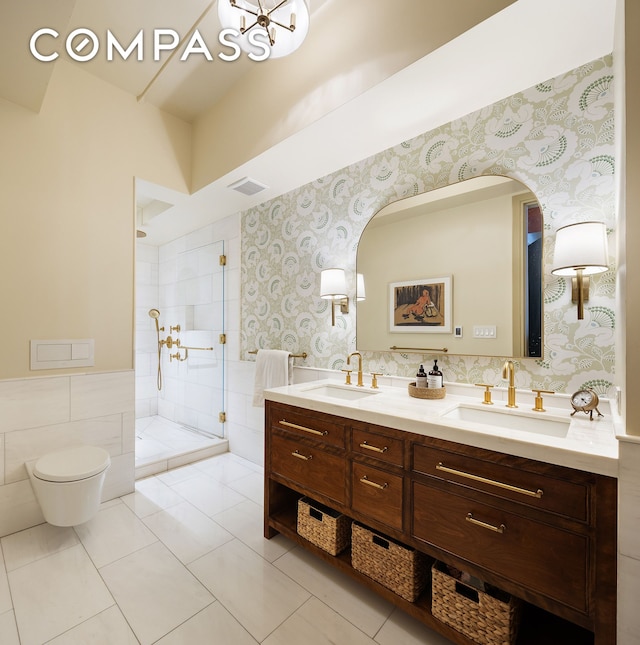 full bathroom with wallpapered walls, a sink, double vanity, and tiled shower