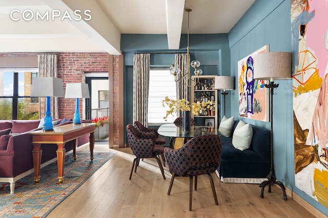 interior space with a notable chandelier and hardwood / wood-style floors