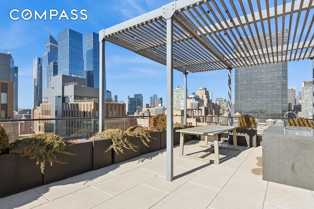 view of patio / terrace featuring a pergola and a view of city