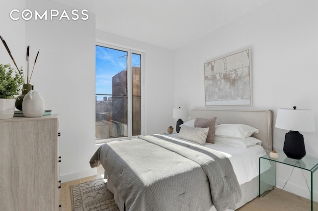 215 W 28th St Unit 11D, New York City, NY 10001 - bedroom featuring wood finished floors