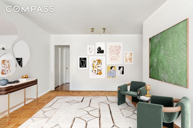 303 E 57th St Unit 30E, New York City, NY 10022 - sitting room featuring baseboards