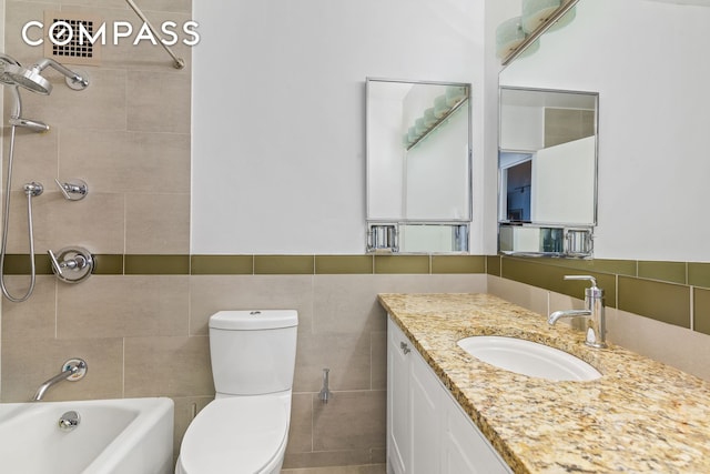 303 E 57th St Unit 30E, New York City, NY 10022 - full bath featuring tile walls, vanity, and shower / bathtub combination
