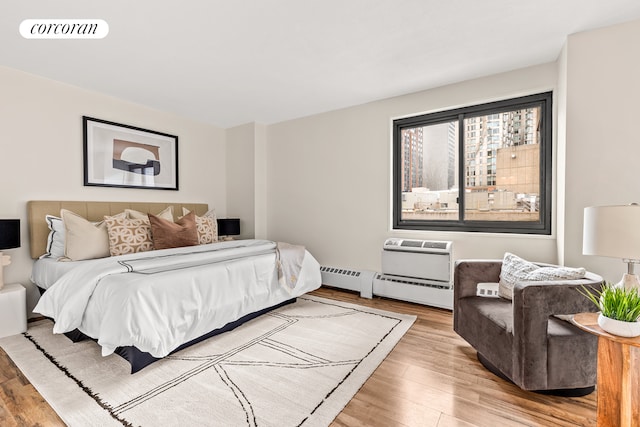 90 Gold St Unit 10L, New York City, NY 10038 - bedroom with wood finished floors and an AC wall unit