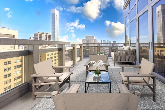 view of patio featuring an outdoor living space, a view of city, and a balcony