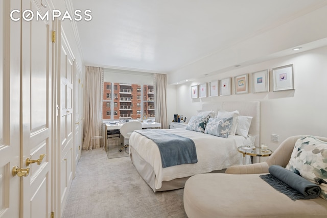 bedroom with light colored carpet and recessed lighting
