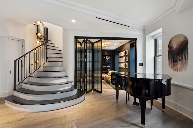 260 W Broadway Unit 9/10B, New York City, NY 10013 - stairs with ornamental molding, wood finished floors, baseboards, and recessed lighting