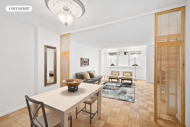 dining space with baseboards and visible vents