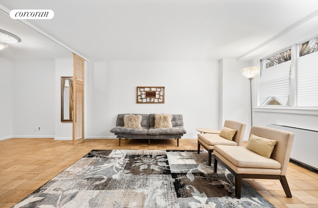 sitting room with visible vents and baseboards