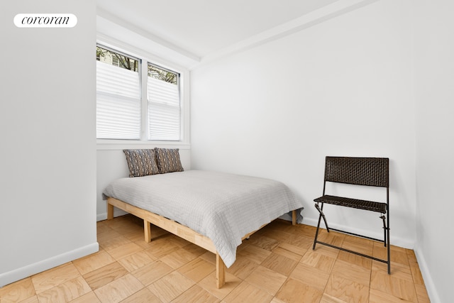 bedroom featuring baseboards