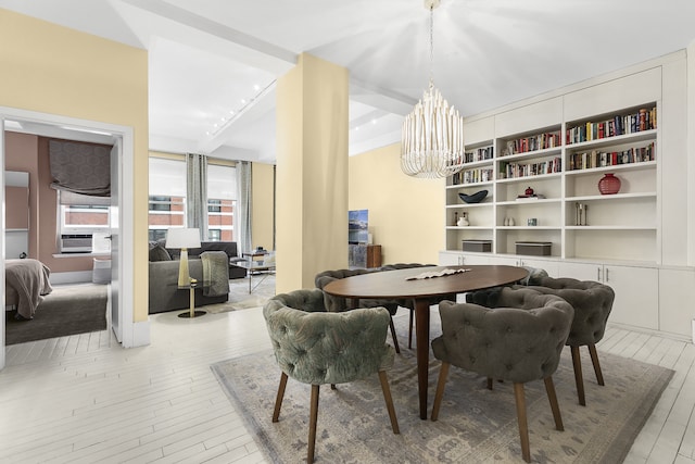 100 Hudson St Unit 4C, New York City, NY 10013 - dining space with light wood-style flooring, a chandelier, and cooling unit