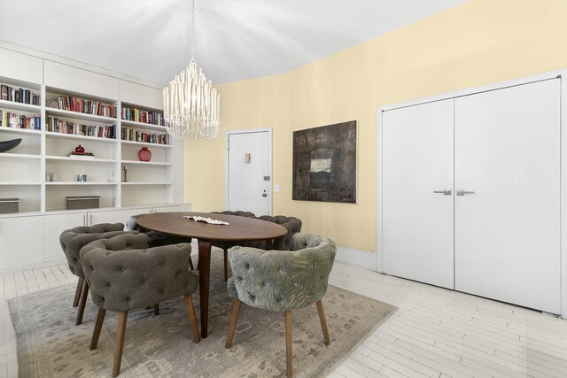 100 Hudson St Unit 4C, New York City, NY 10013 - dining space featuring a chandelier and light wood-style flooring