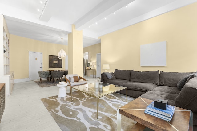 100 Hudson St Unit 4C, New York City, NY 10013 - living room with beamed ceiling, a chandelier, and light wood-style floors