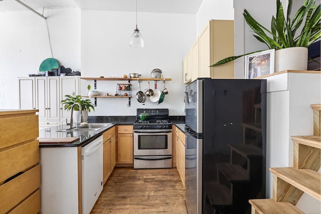689 Myrtle Ave Unit 2E, New York City, NY 11205 - kitchen featuring appliances with stainless steel finishes, a sink, dark wood-style floors, open shelves, and dark countertops