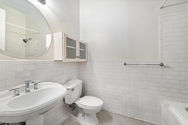 689 Myrtle Ave Unit 2E, New York City, NY 11205 - full bath with tile walls, a tile shower, a sink, toilet, and tile patterned flooring