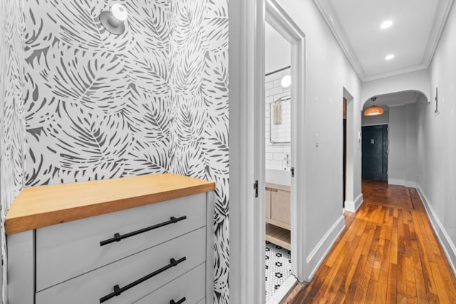 95 Park Ter E Unit 1D, New York City, NY 10034 - corridor with crown molding, wood-type flooring, arched walkways, recessed lighting, and baseboards