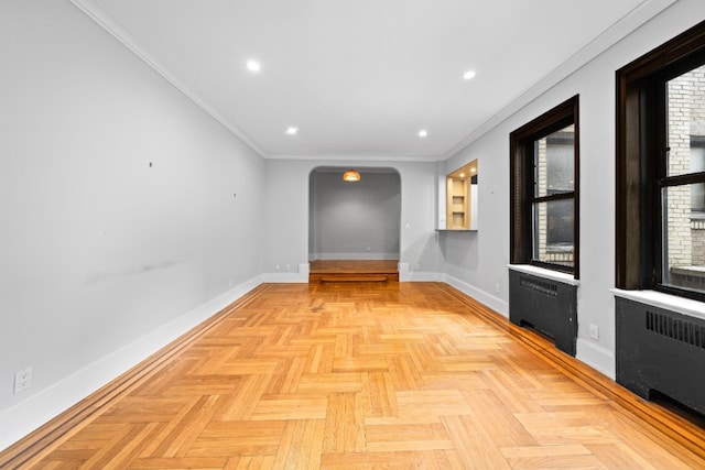 95 Park Ter E Unit 1D, New York City, NY 10034 - hallway featuring radiator heating unit, arched walkways, recessed lighting, and ornamental molding