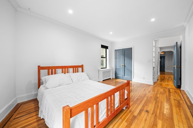 95 Park Ter E Unit 1D, New York City, NY 10034 - bedroom featuring crown molding, recessed lighting, and light wood-type flooring