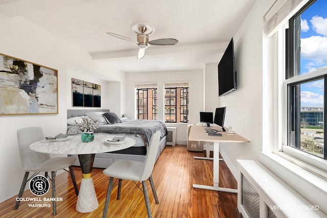25 Tudor City Pl Unit 301, New York City, NY 10017 - bedroom featuring wood-type flooring, a ceiling fan, and radiator heating unit