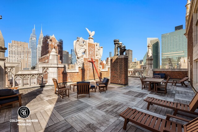 25 Tudor City Pl Unit 301, New York City, NY 10017 - deck with a view of city and outdoor dining space