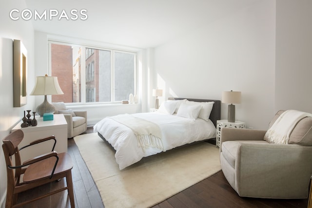 bedroom featuring dark wood-type flooring