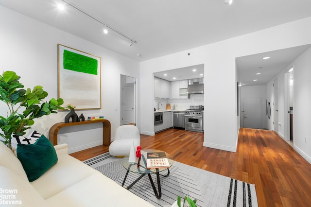 50 W 15th St Unit C1, New York City, NY 10011 - living room with baseboards, recessed lighting, and wood finished floors