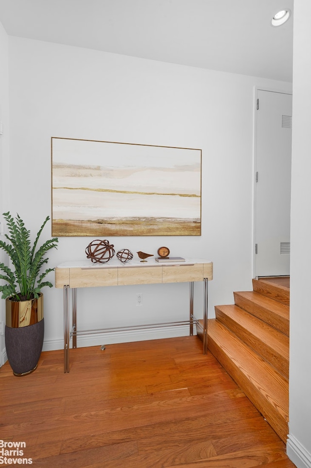 50 W 15th St Unit C1, New York City, NY 10011 - hall featuring wood finished floors, recessed lighting, and stairway
