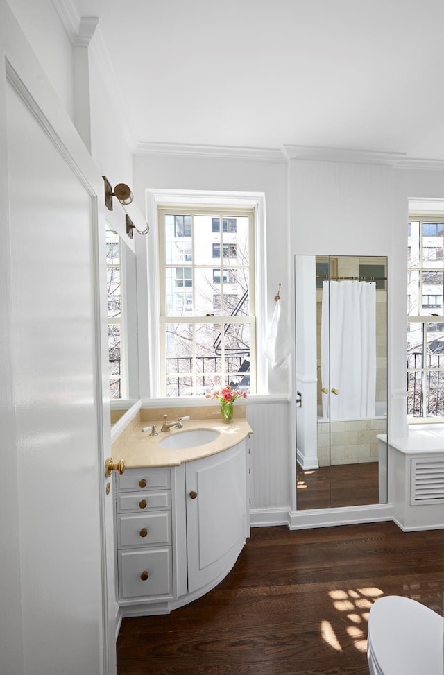 541 E 72nd St Unit 2/3, New York City, NY 10021 - bathroom featuring crown molding, wood finished floors, vanity, toilet, and a shower with shower curtain