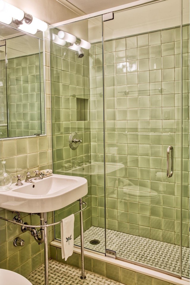 541 E 72nd St Unit 2/3, New York City, NY 10021 - bathroom with a stall shower, tile walls, tasteful backsplash, and toilet