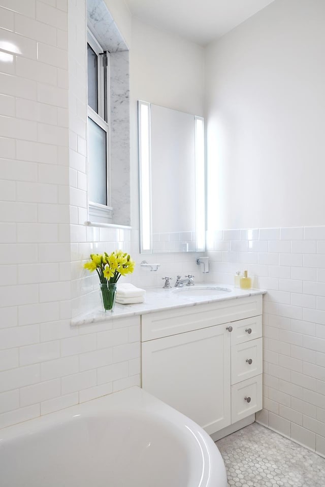 541 E 72nd St Unit 2/3, New York City, NY 10021 - full bathroom featuring a bath, vanity, and tile walls