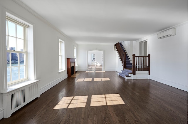 541 E 72nd St Unit 2/3, New York City, NY 10021 - unfurnished living room featuring an AC wall unit, stairway, a fireplace with flush hearth, wood finished floors, and radiator
