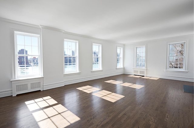 541 E 72nd St Unit 2/3, New York City, NY 10021 - spare room with crown molding, wood finished floors, baseboards, and radiator