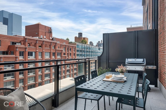 balcony featuring outdoor dining space, a view of city, and a grill