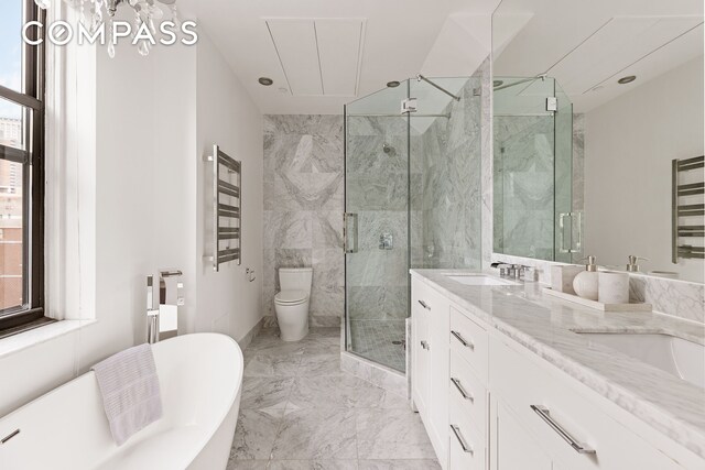 1 Hudson St Unit 9, New York City, NY 10013 - full bathroom featuring marble tiled flooring, a marble finish shower, a freestanding bath, double vanity, and toilet