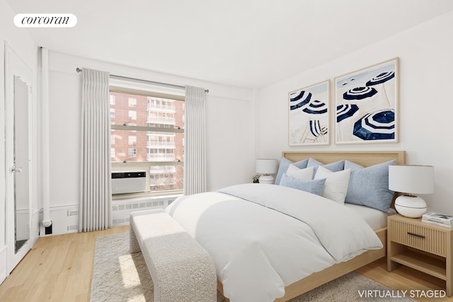 100 La Salle St Unit 10C, New York City, NY 10027 - bedroom featuring wood finished floors and radiator heating unit