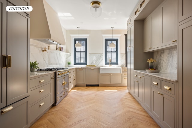 kitchen with premium range hood, backsplash, a sink, and stainless steel gas stovetop