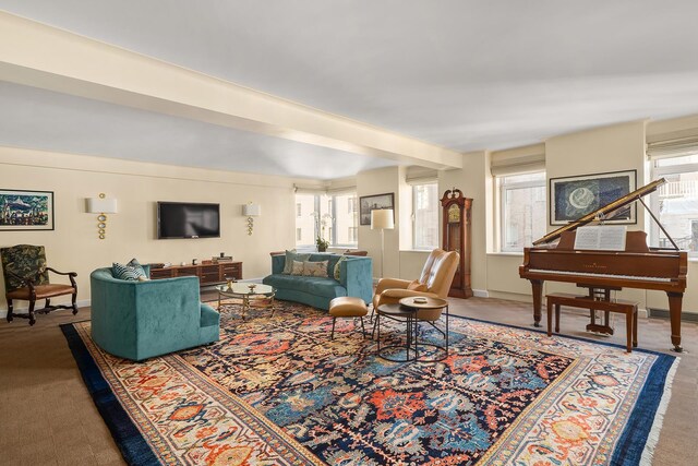 living room featuring carpet floors and baseboards