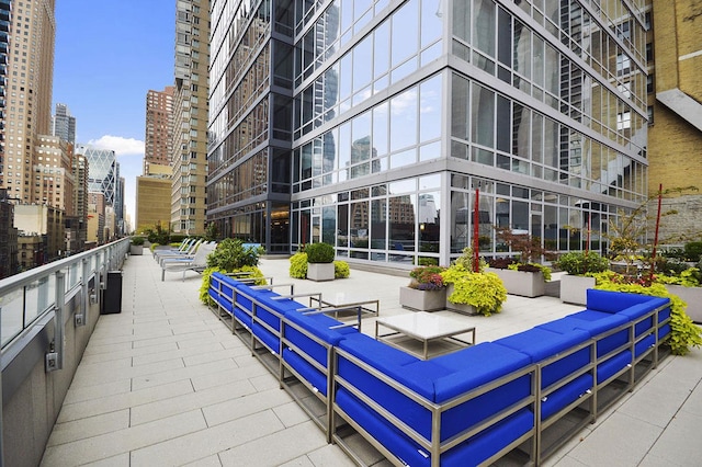247 W 46th St Unit 2202, New York City, NY 10036 - view of community featuring a view of city and an outdoor living space