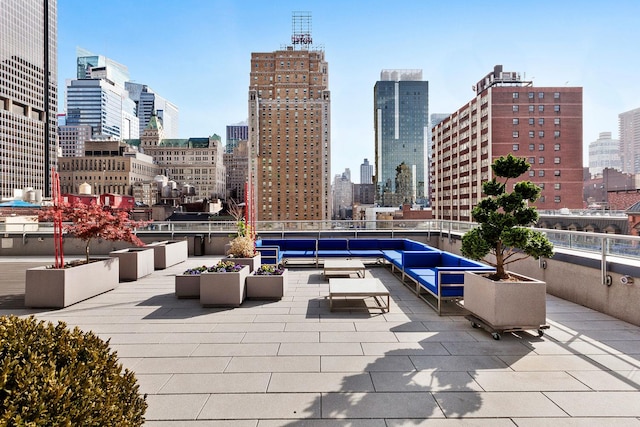 view of patio / terrace with an outdoor hangout area and a city view