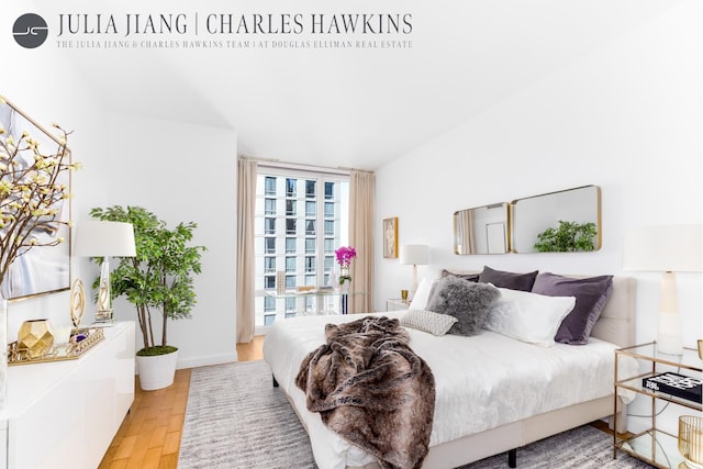 247 W 46th St Unit 2202, New York City, NY 10036 - bedroom with wood finished floors and baseboards