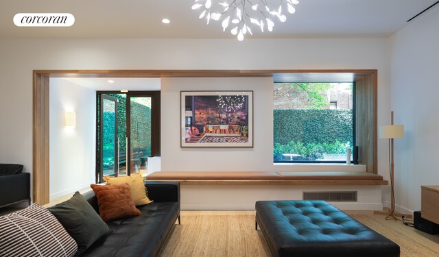 234 E 46th St Unit 202, New York City, NY 10017 - living area featuring a chandelier, recessed lighting, and baseboards