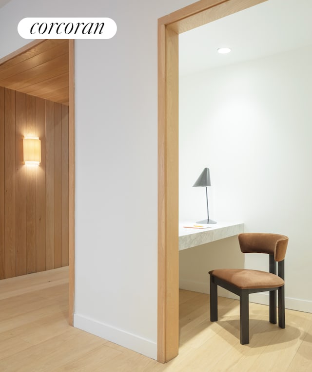 234 E 46th St Unit 202, New York City, NY 10017 - hall with wood finished floors, baseboards, and wooden walls