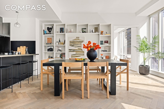 330 Spring St Unit 7D, New York City, NY 10013 - dining room featuring plenty of natural light and built in shelves